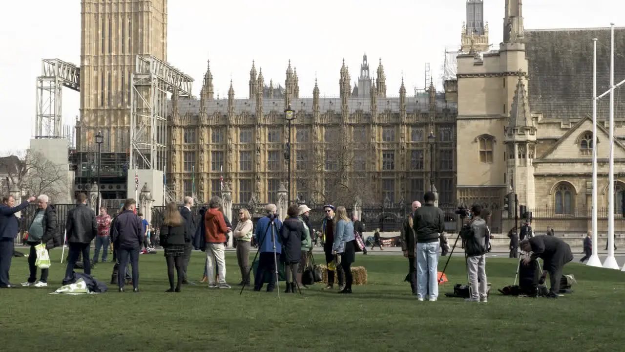 People And Camera Crews Getting Ready On Parliament Square Garden On 17 March 2022