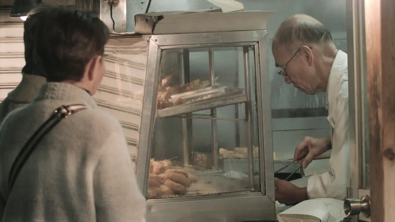 Customers Ordering Sweets from a Japanese Bakery in Tokyo