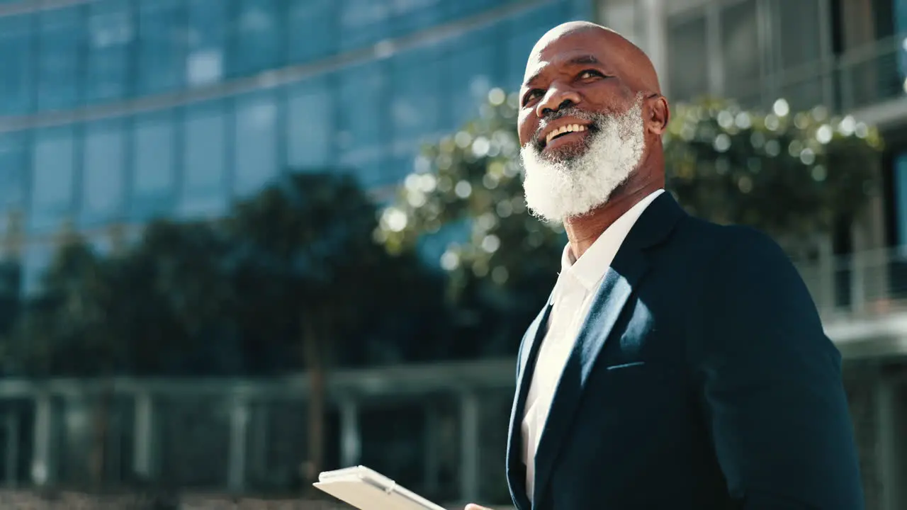 Mature man tablet and outside of office park