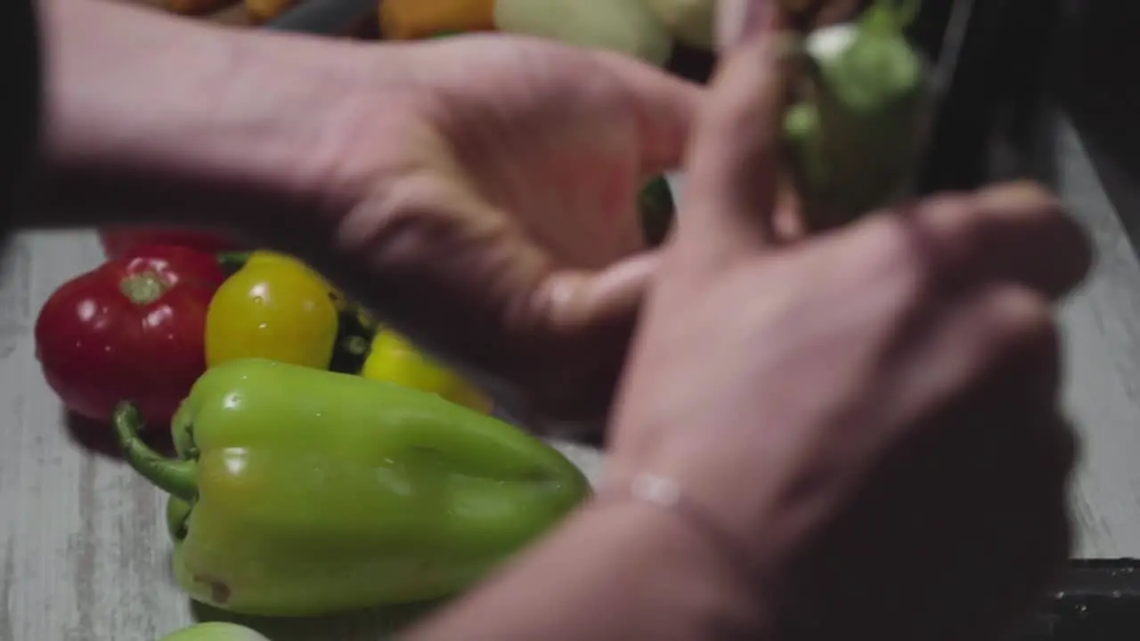 Women's hands wash peel and cut vegetables into vegetable stew