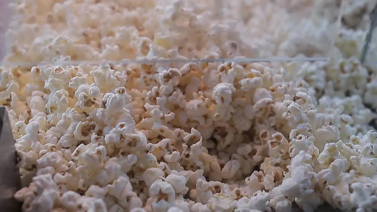 A lot of popcorn pours in Close-up