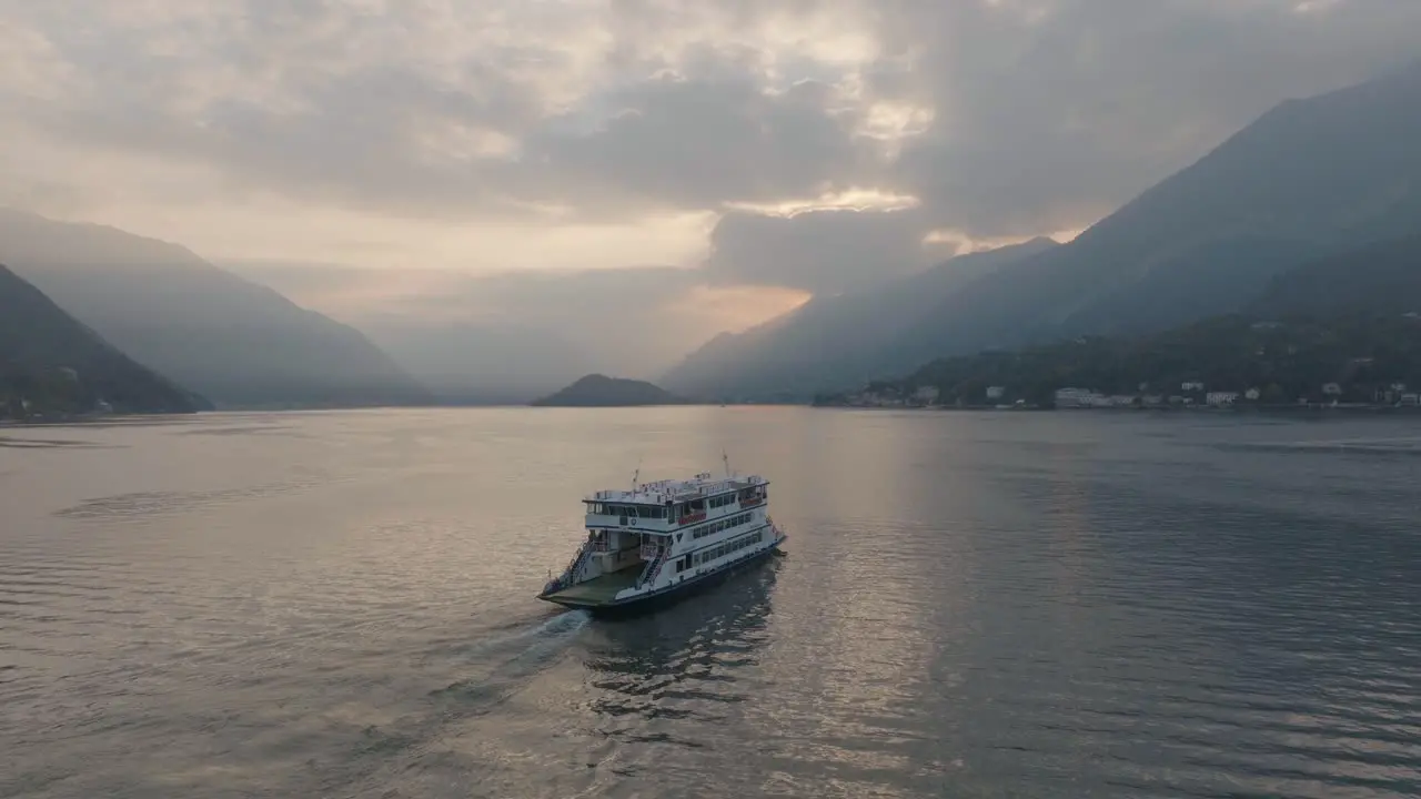 4K Aerial Sunset Slowly following a ferry in Lake Como Italy