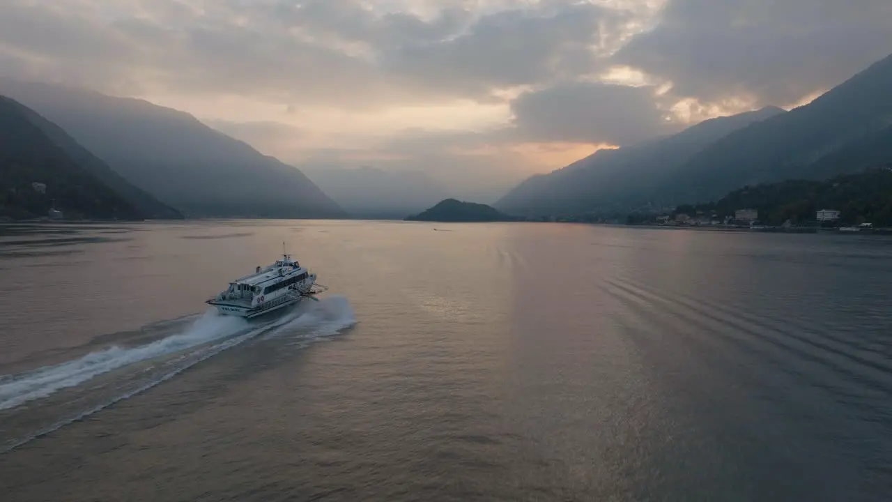 4K Aerial Sunset shot chasing a hydrofoil on Lake Como Italy