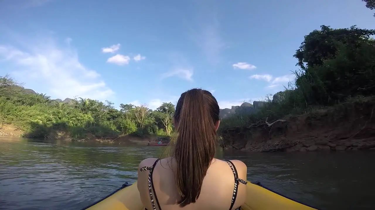 girl canoeing down river thailand khao sok national park