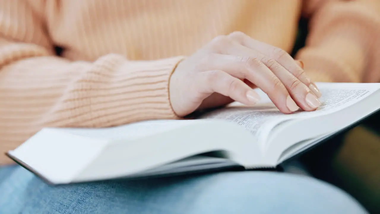 Woman reading and hand in bible study