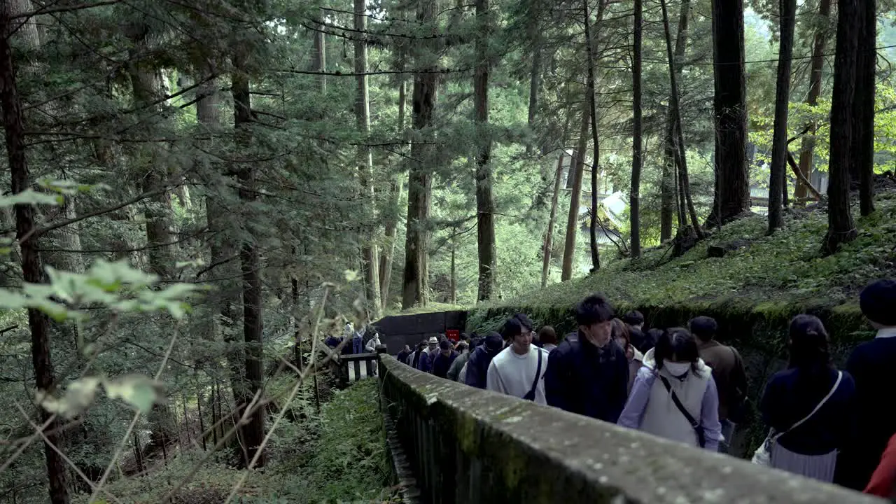 People climb the staircase to Okusha Hoto in Nikko to see the remains of Tokugawa Ieyasu