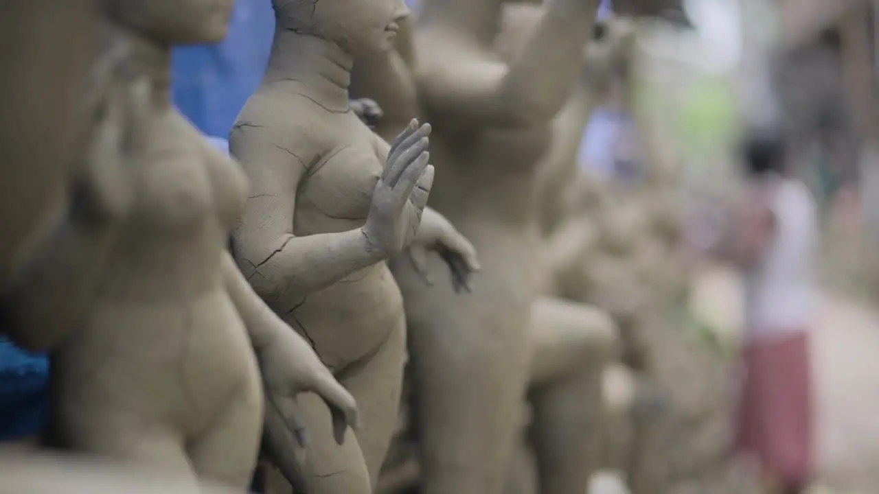 Making of of an idol of Hindu goddess Durga at Kumartuli in Calcutta slow motion focus shift