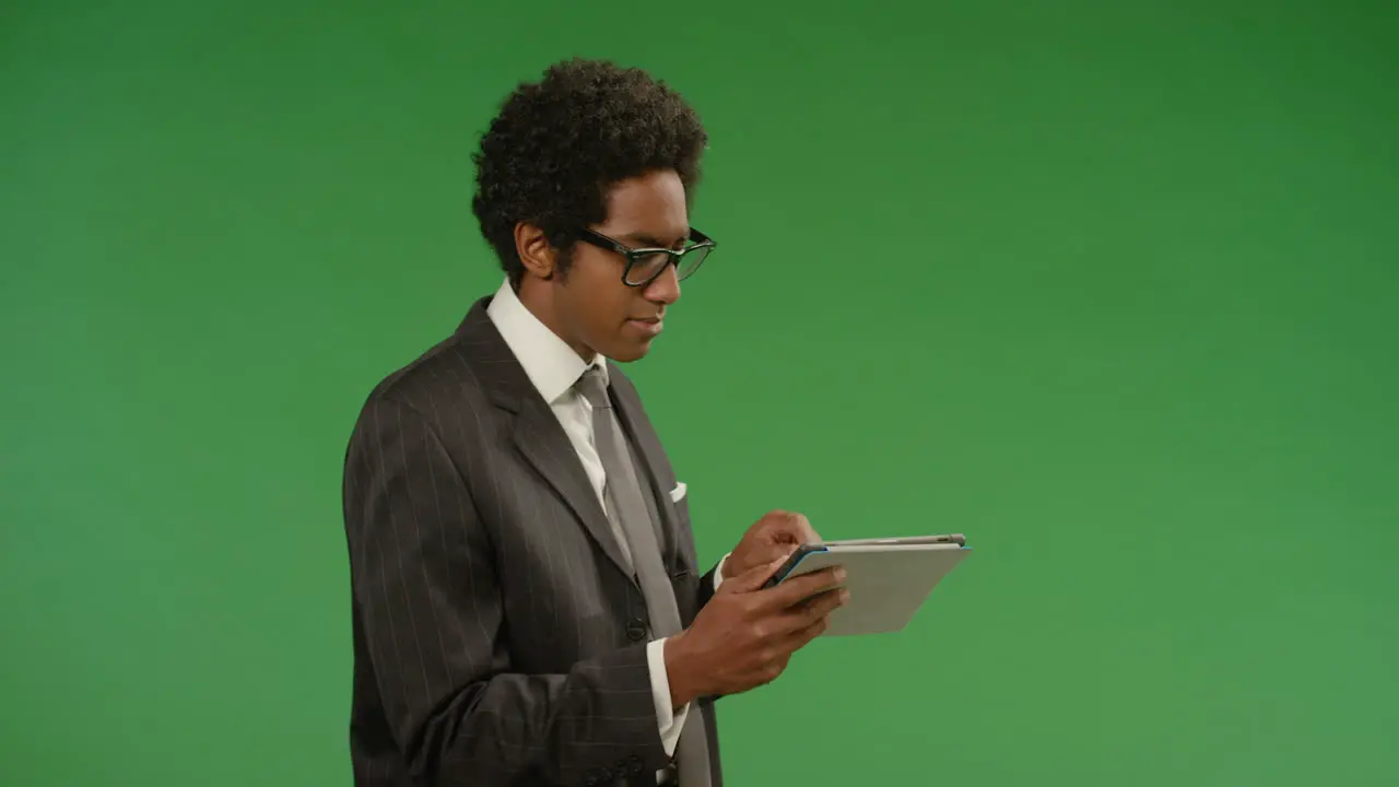 Annoyed Businessman Uses Tablet on Green Screen