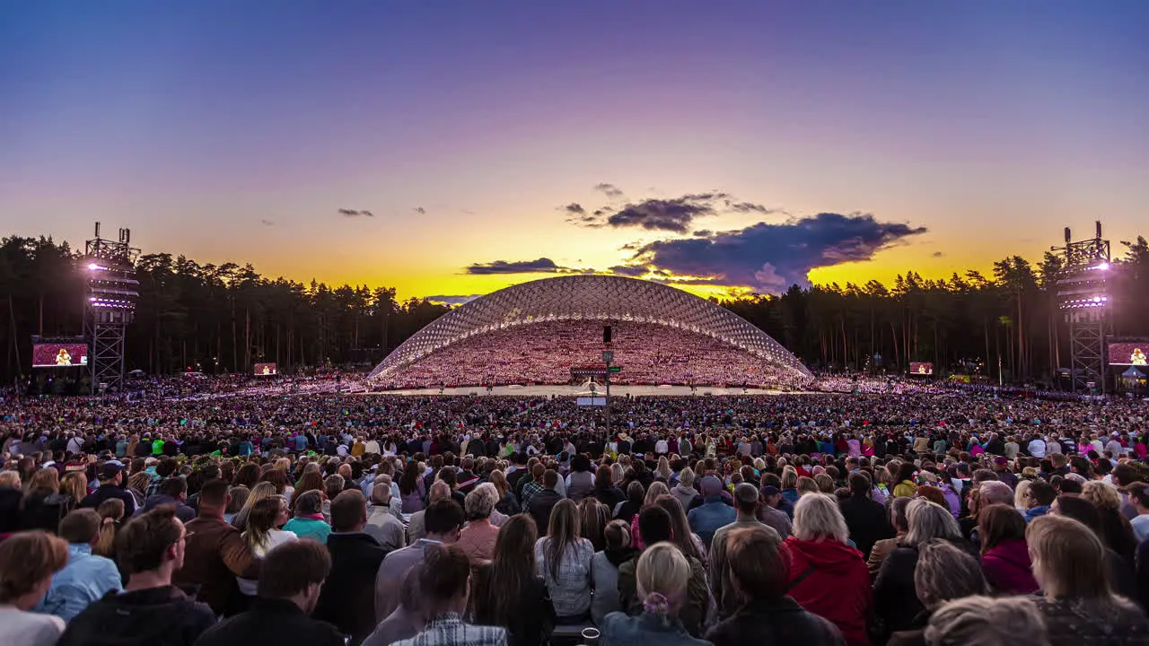 Latvian Song and Dance festival time lapse of crowd and performances at sunset