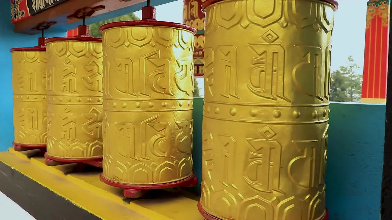 Buddhist monastery spinning prayer wheels close up at monastery from flat angle video is taken at bomdila monastery arunachal pradesh india