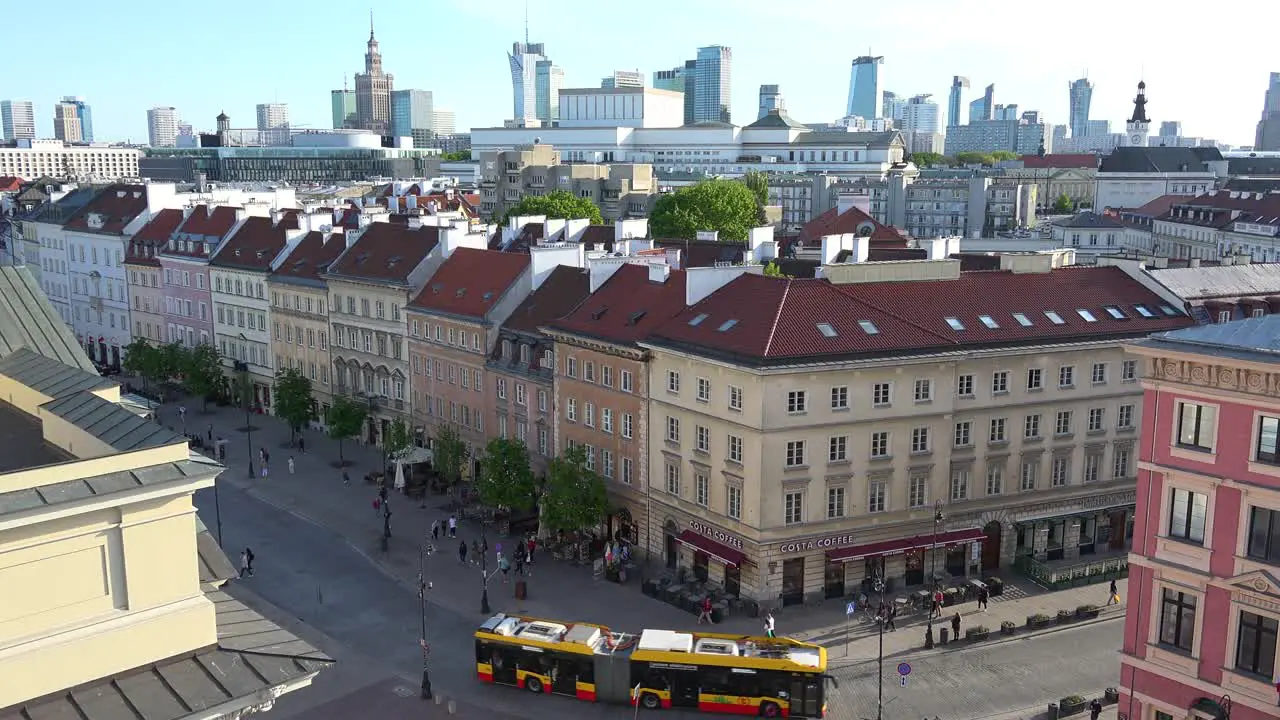 Nice Establishing Shot Of Downtown Warsaw Poland Framed By The Old City Warszawa In Foreground With City Bus Passing