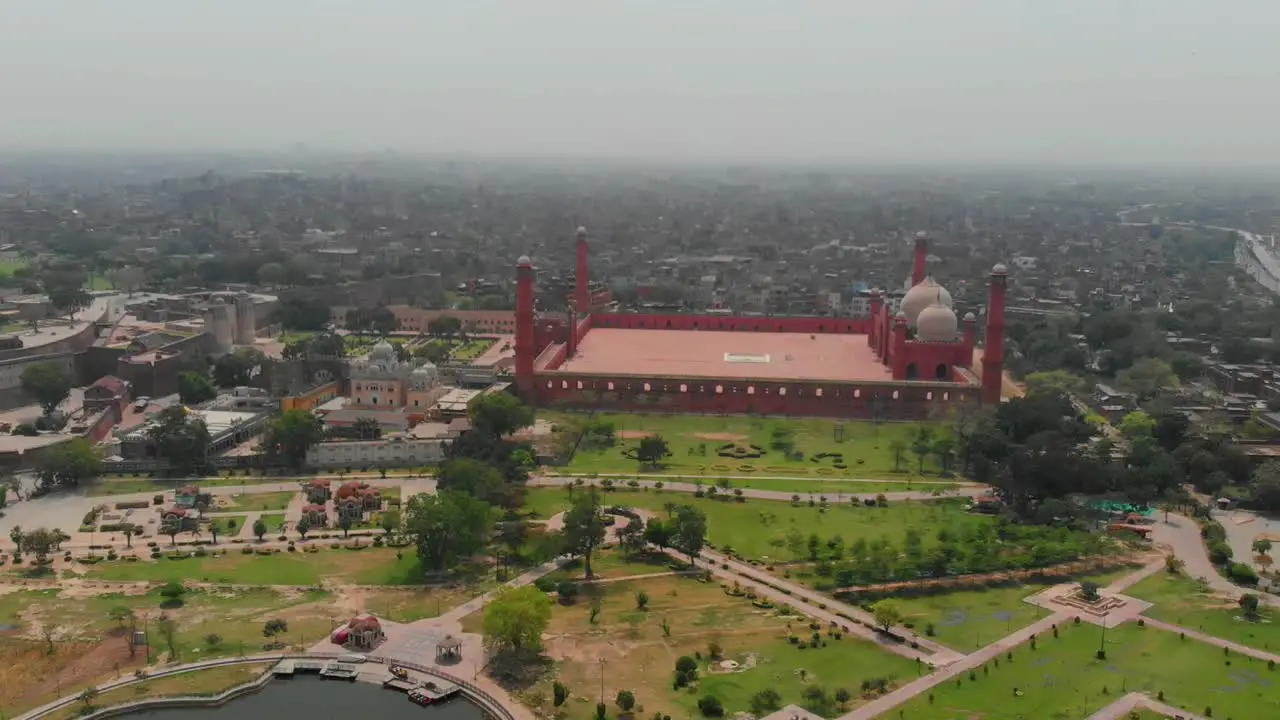 Aerial Over Green Gardens Next To Badshahi Mosque In Pakistan