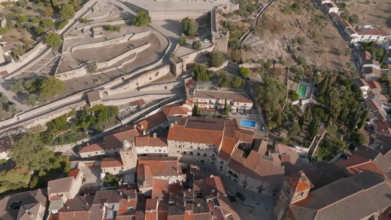 Orbiting overhead aerial view of historic medieval village of Trujillo Extremadura Spain