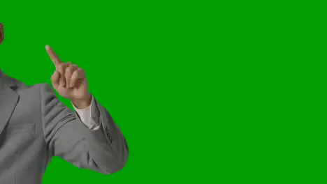 Close Up On Hand Of Businessman In Suit Pretending To Use AI Or VR Against Green Screen 1