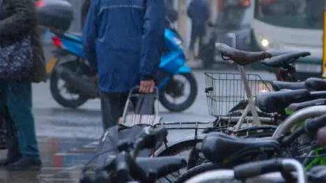 Medium Shot of Pedestrians Walking In Rain 