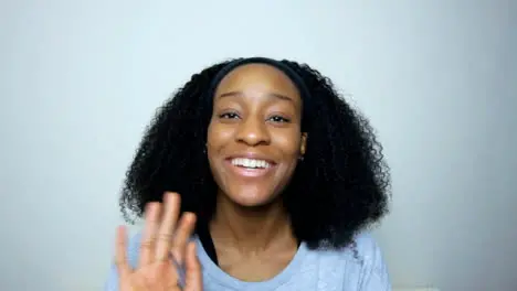 Young Student Greeting and Talking Directly to the Camera