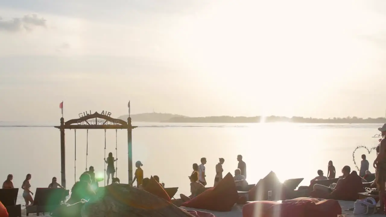 People on a Beach with Beanbags and Swing