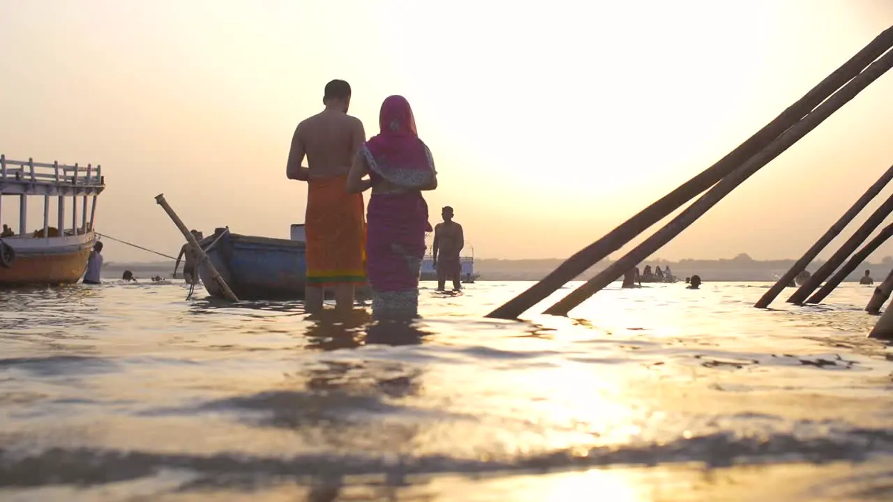 Couple Praying in River Ganges