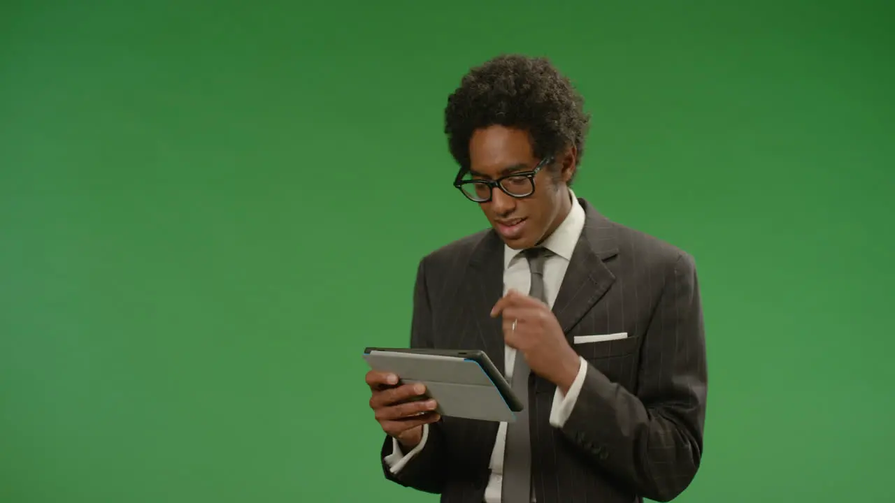 Businessman Using Tablet While Moving on Green Screen