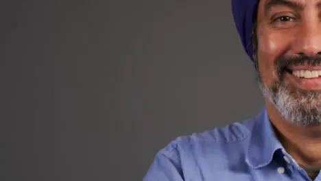 Middle Aged Man In Turban Smiling with Copy Space