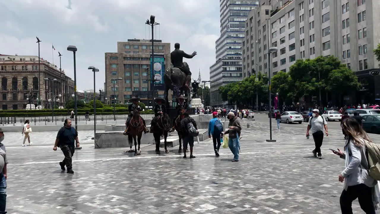 shot of mounted police in the alameda central of mexico city during the morning