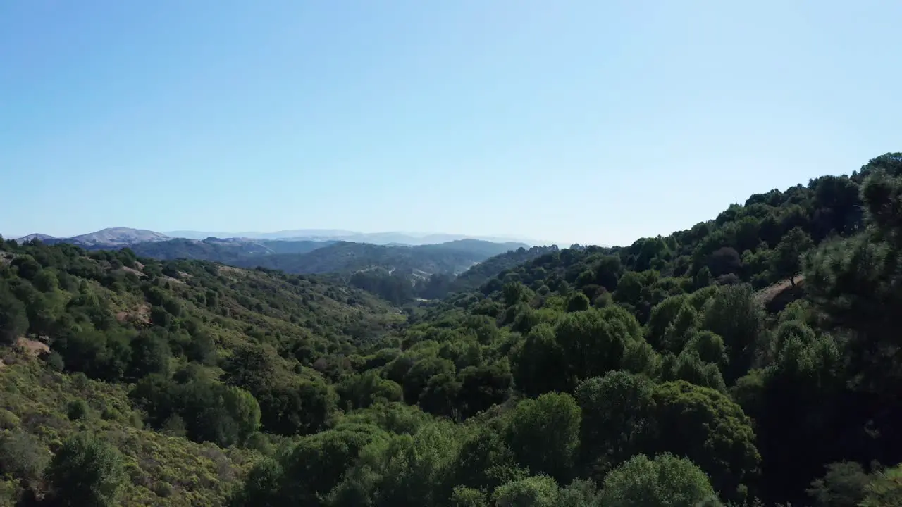 Cinematic opening scene of a large valley and sunshine