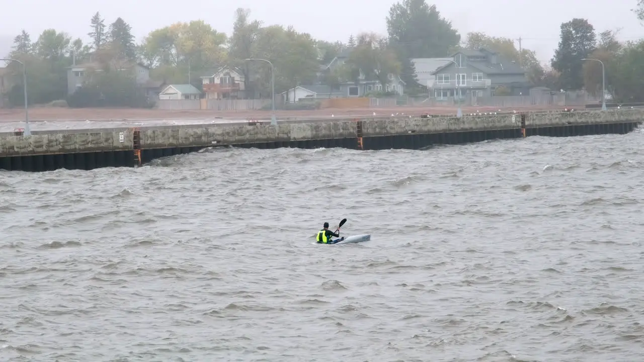 Sea Kayaker Navigating Choppy Canal Waterway