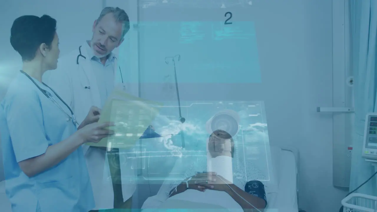 Animation of data on digital screens over diverse female and male doctors and male patient on bed