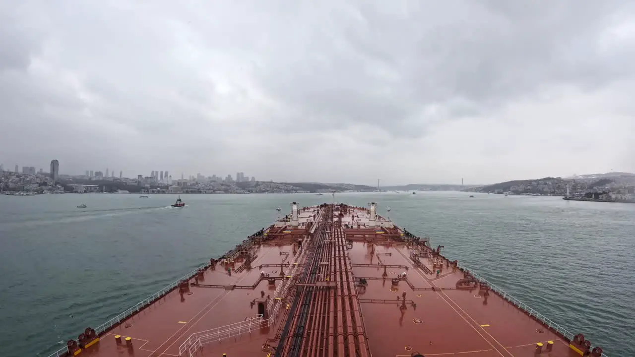 Timelapse oil tanker bow crossing Bosphorus strait west entrance cloudy day