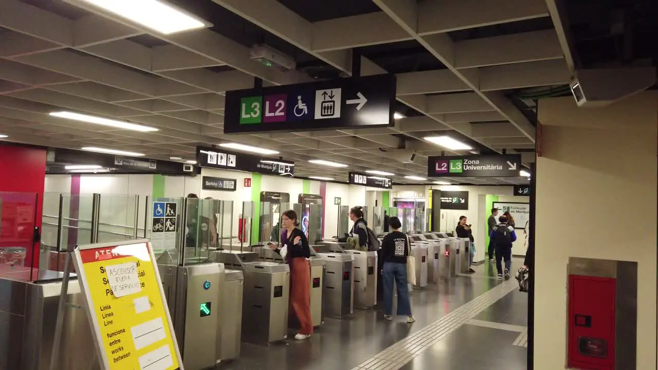 People Enter the Commuter Underground Metro of Barcelona City Spain L2 L3 Lines