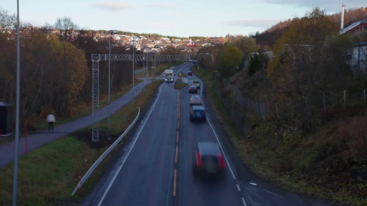 Timelapse Of Road Traffic With Speeding Vehicles During Sunset In Autumn At Tromso Norway