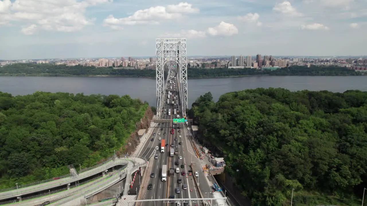 Smooth aerial view of George Washington Bridge toward New York City 4K