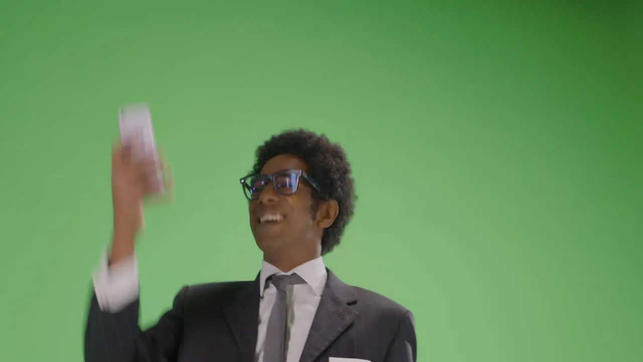 Low Angle Businessman finding phone signal on green screen