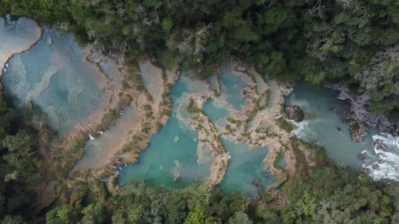 Straight down aerial of Semuc Champey river dam waterfalls Guatemala