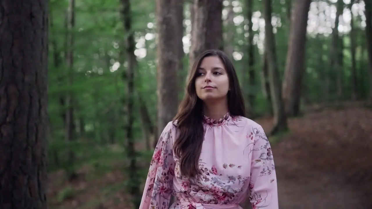 Beautiful Girl Wearing Floral Pink Dress Walking Alone In Wilderness