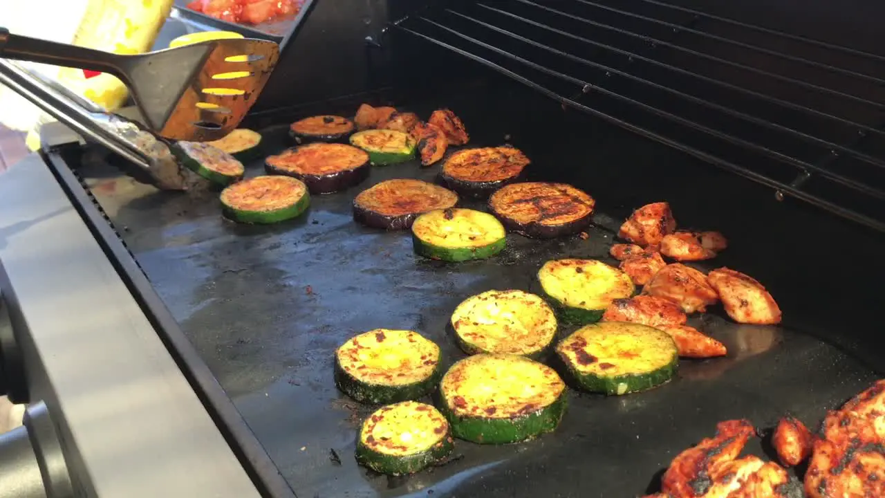 Assorted veges being cooked on the BBQ during a hot summer day