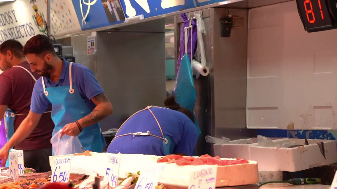 Fish vendors in local market selling fresh food