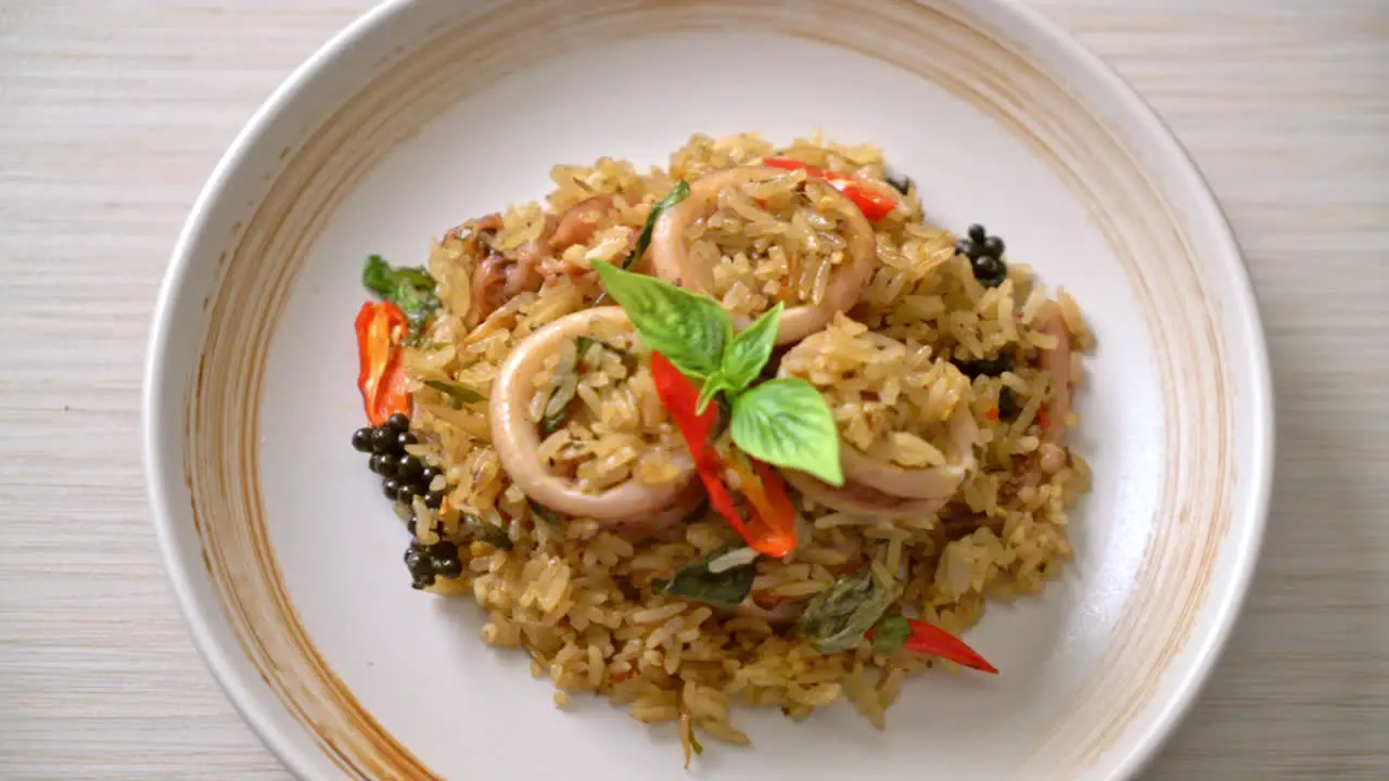 Homemade Basil and Spicy Herb Fried Rice with Squid or Octopus Asian food style