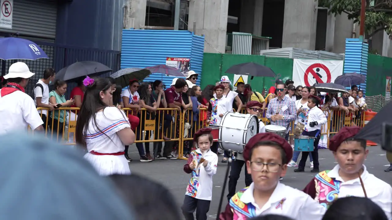 Young Student Marching Band Walking Down Avenue During Costa Rican Independence Day Parade