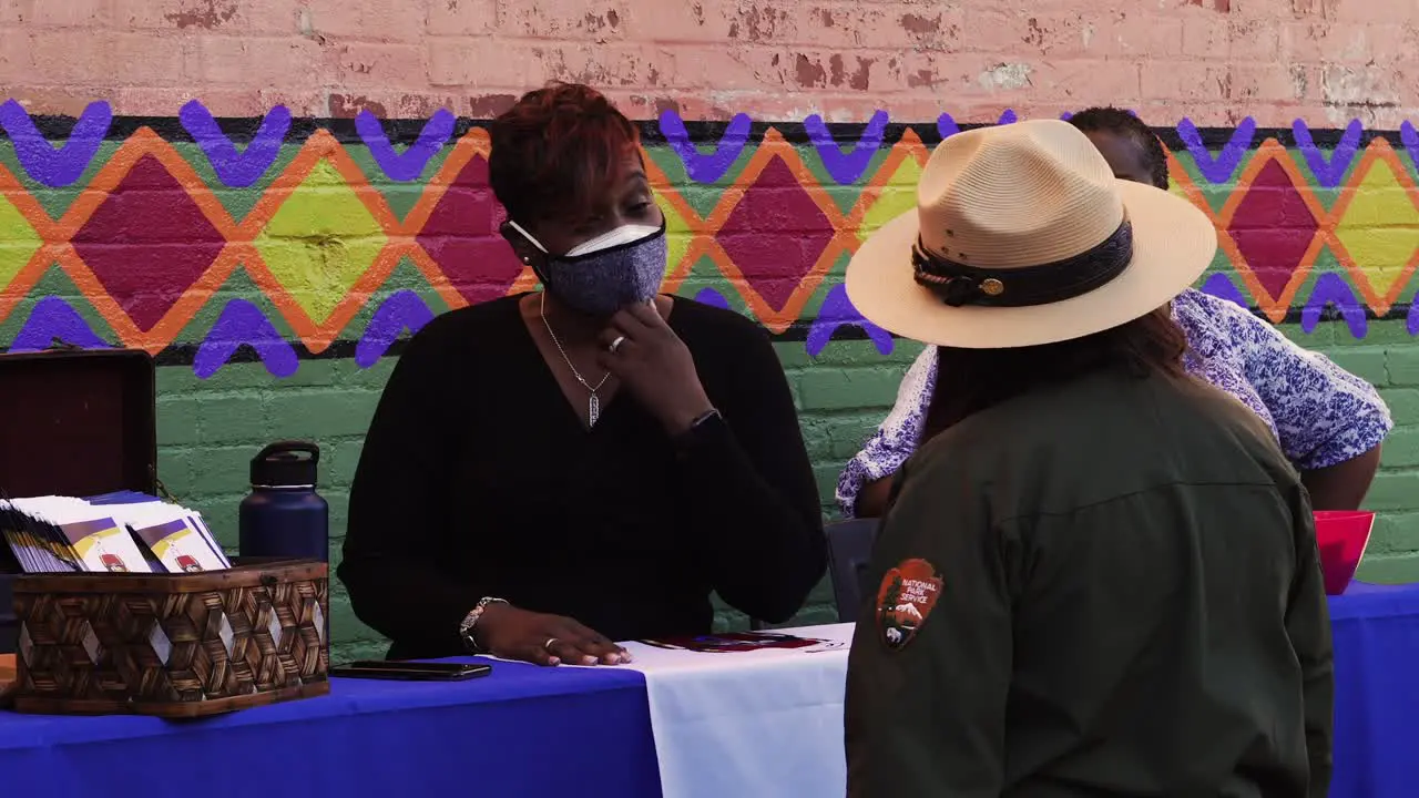 Americus First Friday Art Event Sumter County Artsapalooza people discussing art at outdoor street event