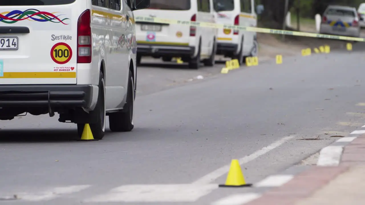 Police forensic evidence markers at shooting murder crime scene South Africa