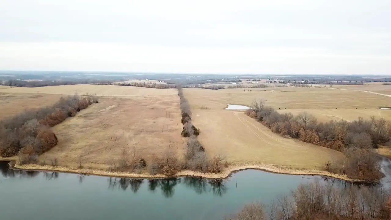 Flying over lake in empty fields no people around just amazing deserted scenery