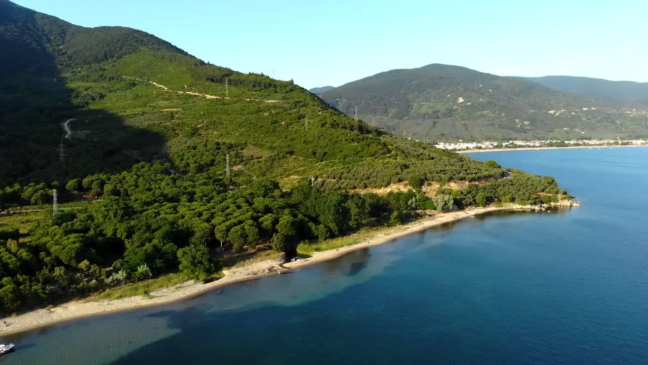 Aerial flight through beautiful mountain over Marmara Sea and cars are driving on the ridgeway Balikesir Turkey