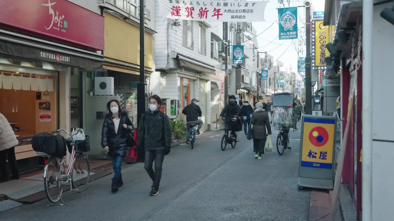 People Wearing Masks On The Streets Of Tokyo On New Year Day During The Pandemic Medium Shot