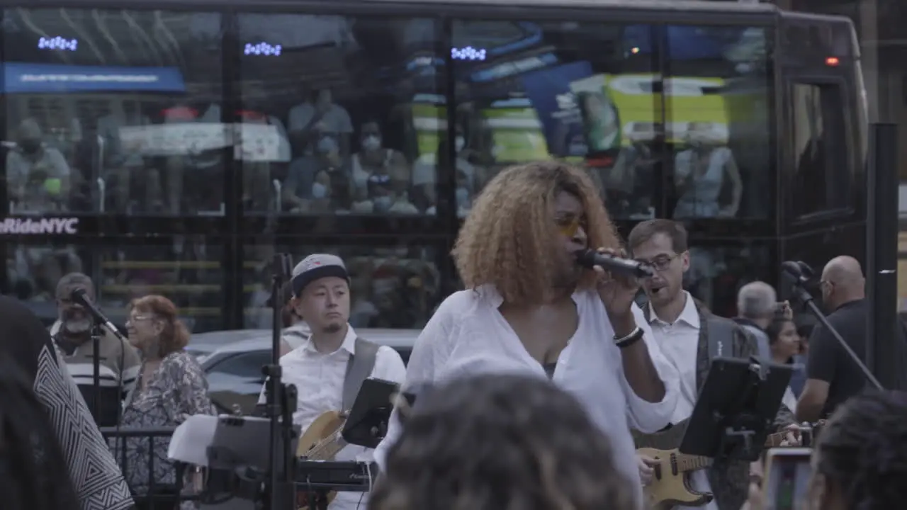 Static shot of a live band playing and performing in New York City