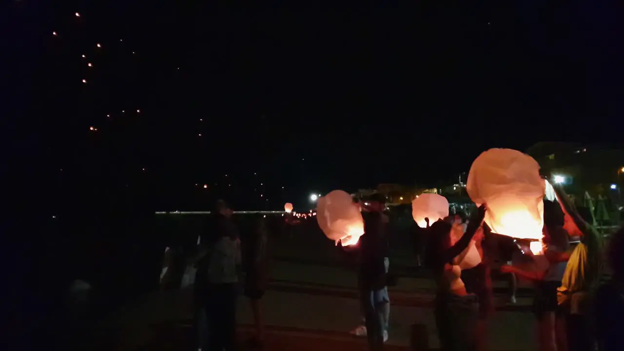 Lots of Chinese paper lanterns flying at Francavilla Festival in Italy