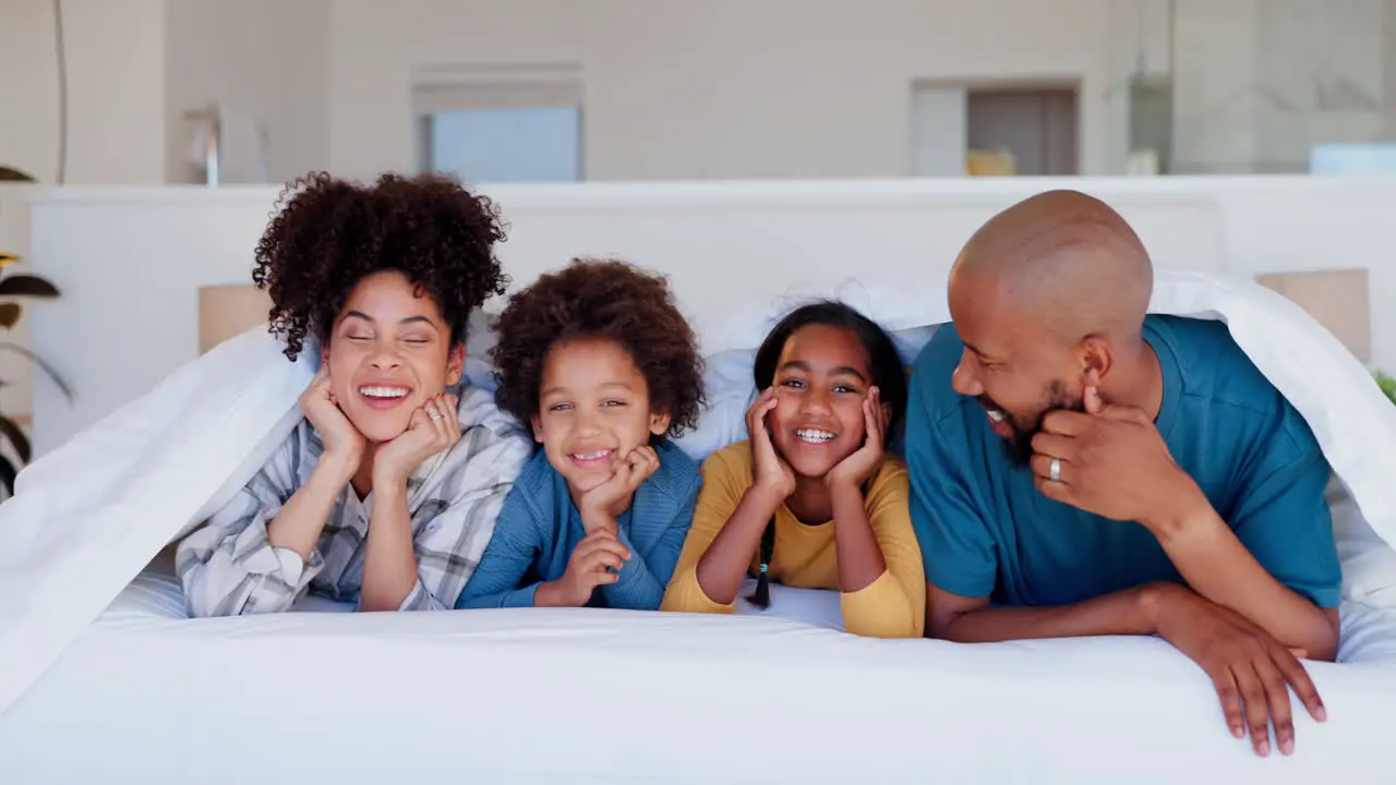 Happy family face and love by blanket on bed