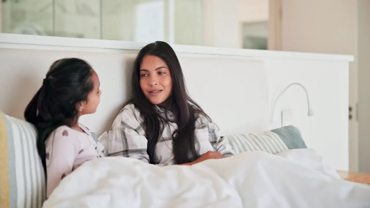 Mom girl and talk in bed morning