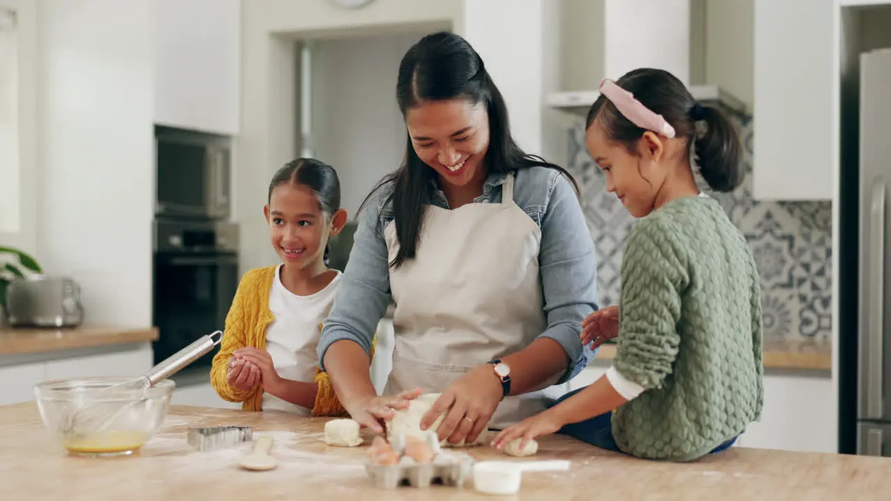 Baking happy family and mother teaching children