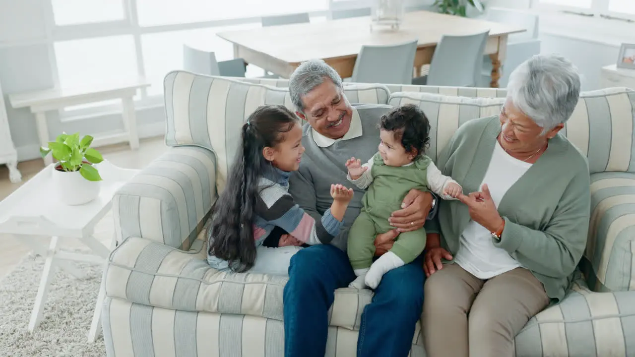 Children grandparents and happy family at home